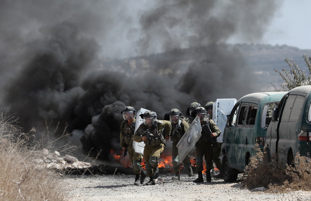 Five Palestinians and a foreign activist shot, injured as Israeli enemy 