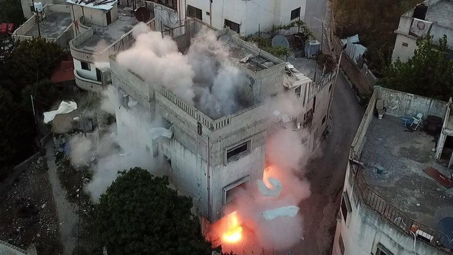 Zionist enemy forces bombed martyr Al-Khawaja's house in Ramallah, amidst clashes