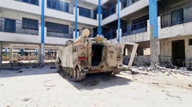Zionist army deserts personnel carrier burning in UNRWA Rafah school
