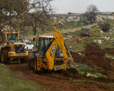 Settlers leveling lands in Burqa, northwest of Nablus