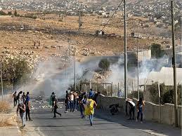Zionist troops raid Husan village, 2 civilians injured, another arrested