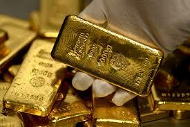 Gold retreats after hitting highest level