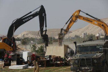 Zionist enemy bulldozers demolish three houses in Jericho