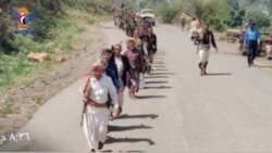 Security personnel march in Qafl Shammar district to emphasize readiness to confront enemy